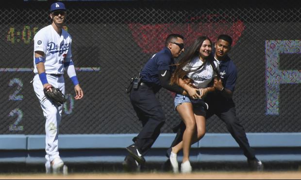 Watch 14-Year-Old Girl Run Onto Field To Hug Dodgers' Cody Bellinger