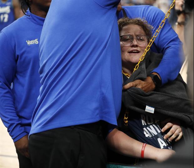 Fan Chained Herself ToThe Back Of The Goal During Grizzlies vs. Timberwolves Game