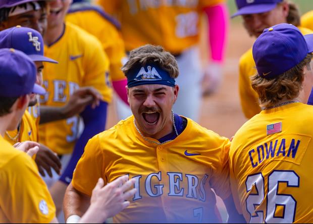 Watch: Jake Brown Jumps Into The Outfield Stands To Celebrate With LSU Fans After Natty