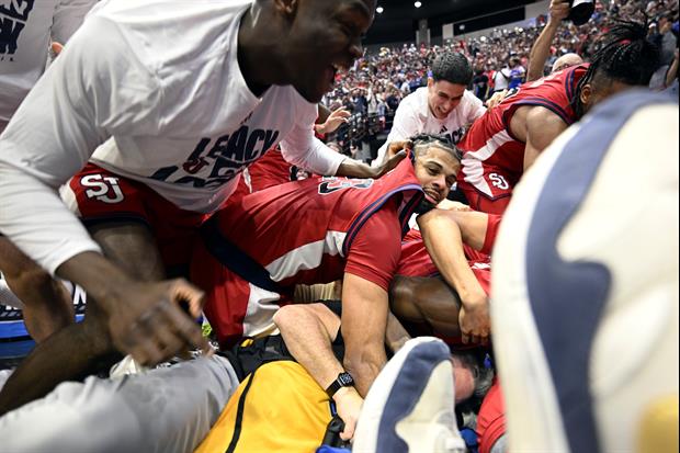 Funny Pic Of Photographer Stuck At The Bottom Of St. John's Celebration Pile