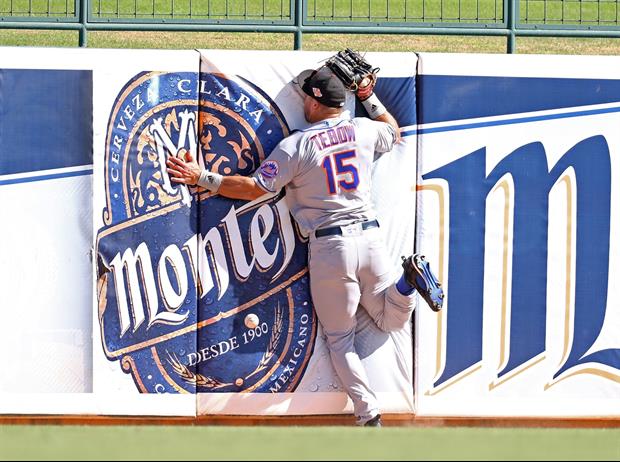 Tim Tebow Face Plants Into Wall Going For Fly Ball