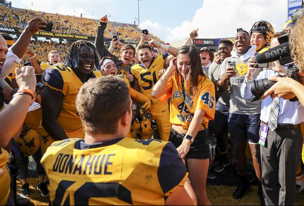 Check out West Virginia DE Reese Donahue give his girlfriend a wedding proposal either of them will
